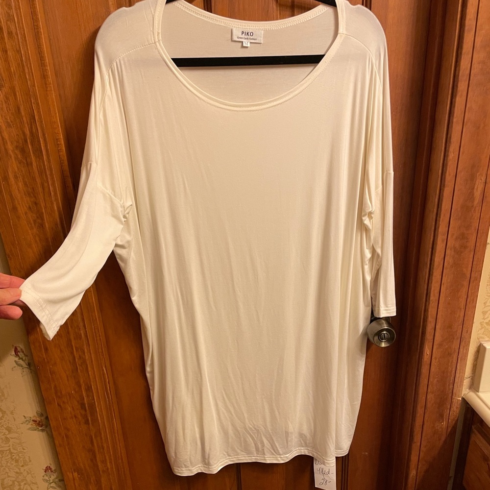 Piko cream top. Sz. Medium. Runs large. Drop-shoulders. NWT. cotton spandex.
